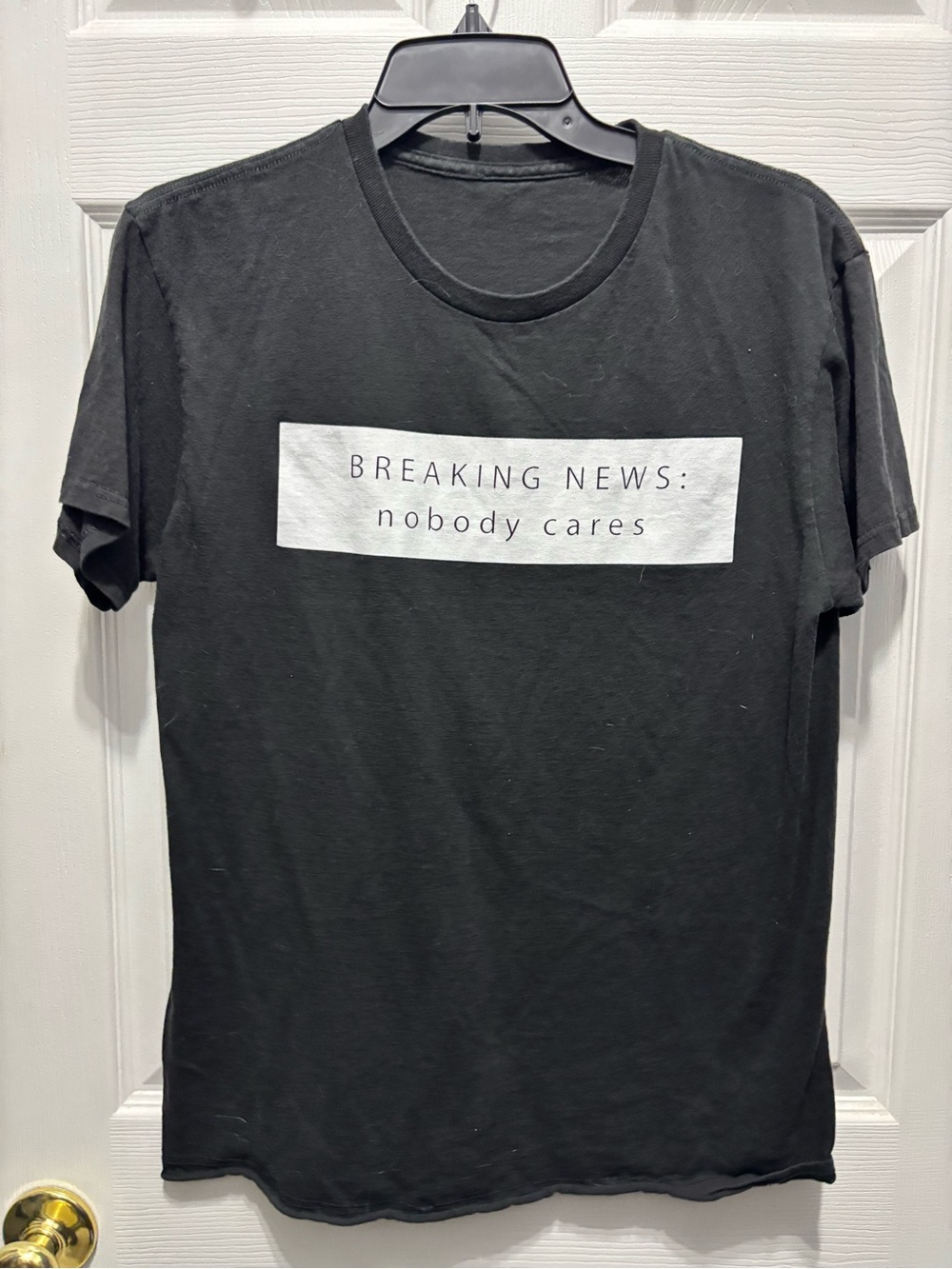 Black Graphic Tee - "Breaking News: nobody cares"